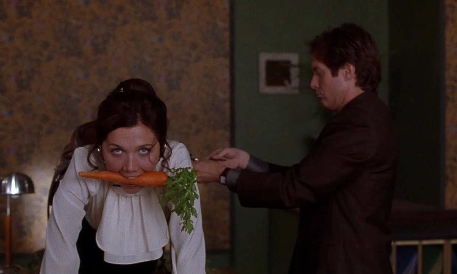 Maggie Gyllenhaal and James Spader in Secretary, 2002