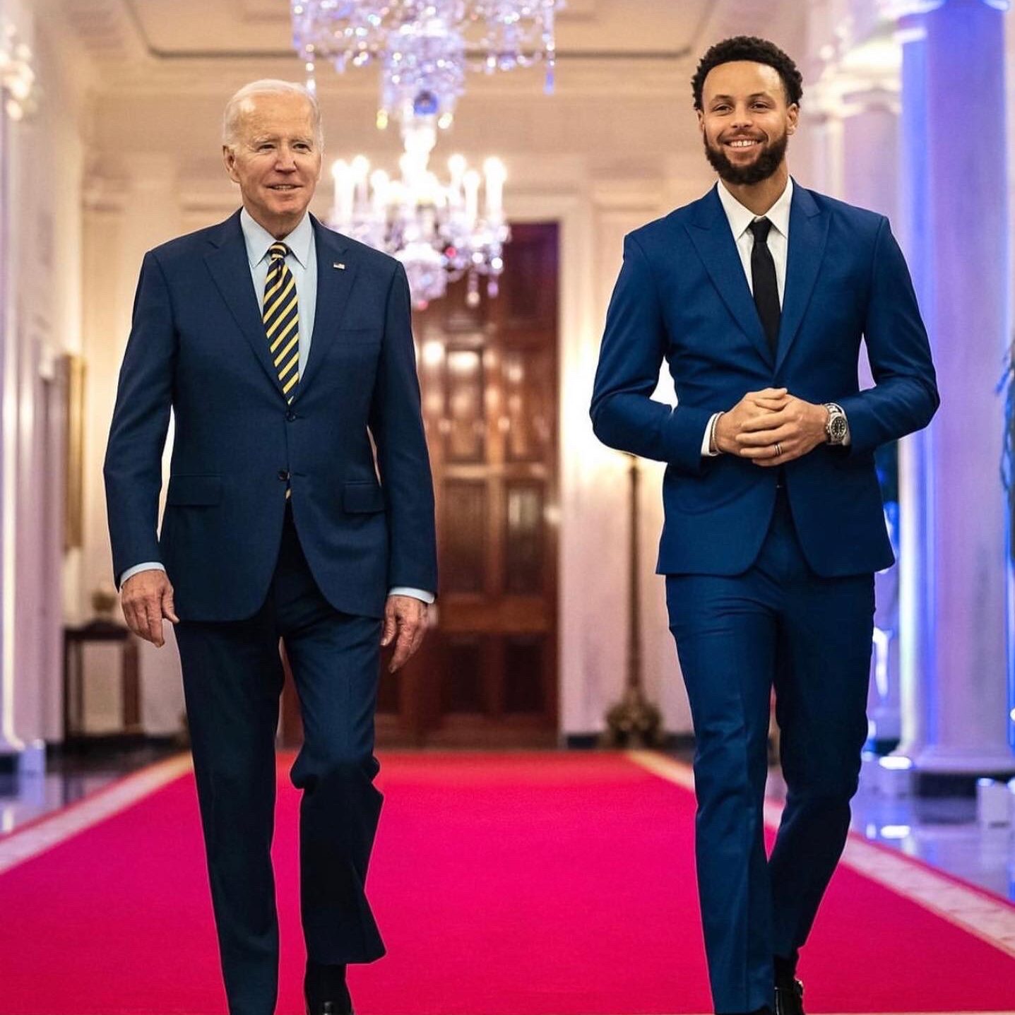 Basketball player Steph Curry wears a LaTouché suit with President Joseph R. Biden in the White House