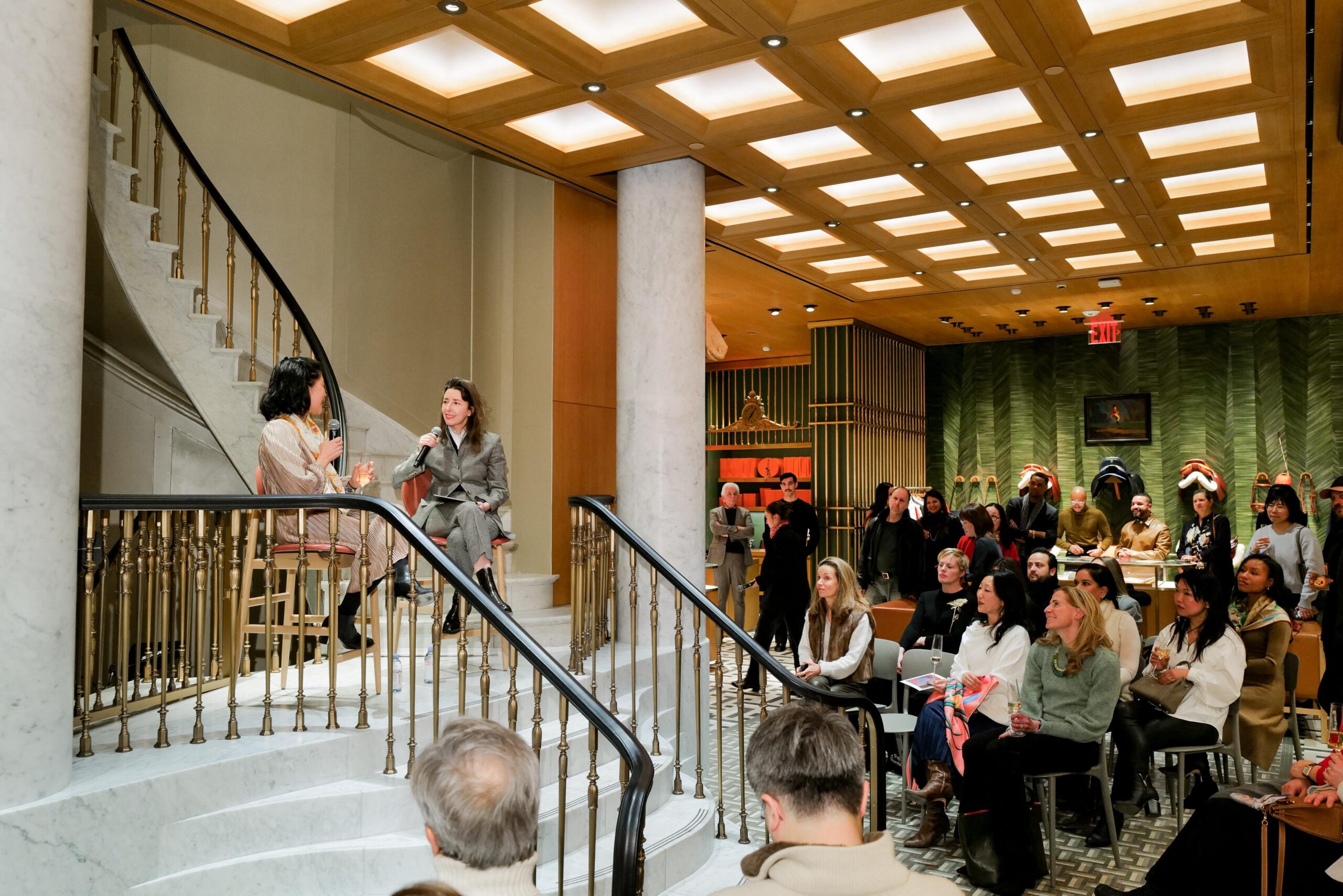 Lisha Bai and Alexandra Cunningham Cameron speak to a packed crowd, on a panel at the Hermes Maison Madison 