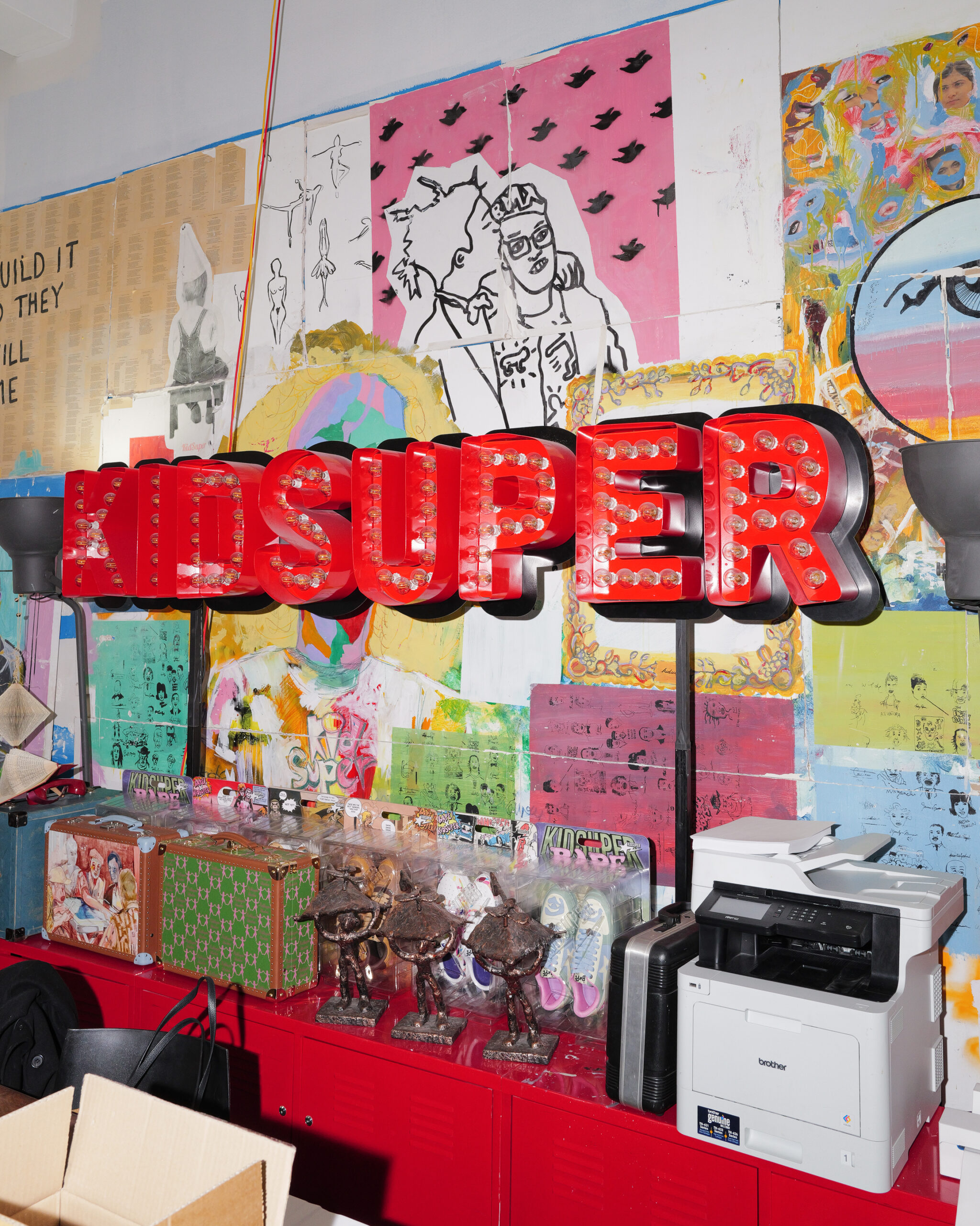 A display with the KidSuper logo at the KidSuper Studios