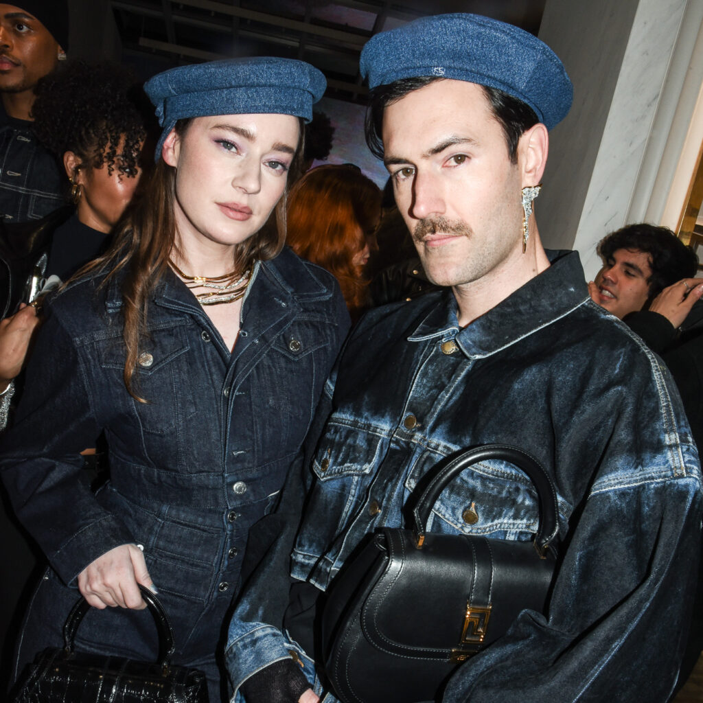 Young Emperors pose for a photo at the Versace SoHo store