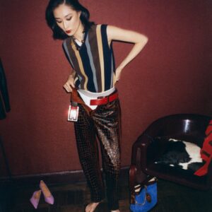 A woman tries on an array of garments in Versace's Spring/Summer 2026 campaign shot by Tania Franco Klein