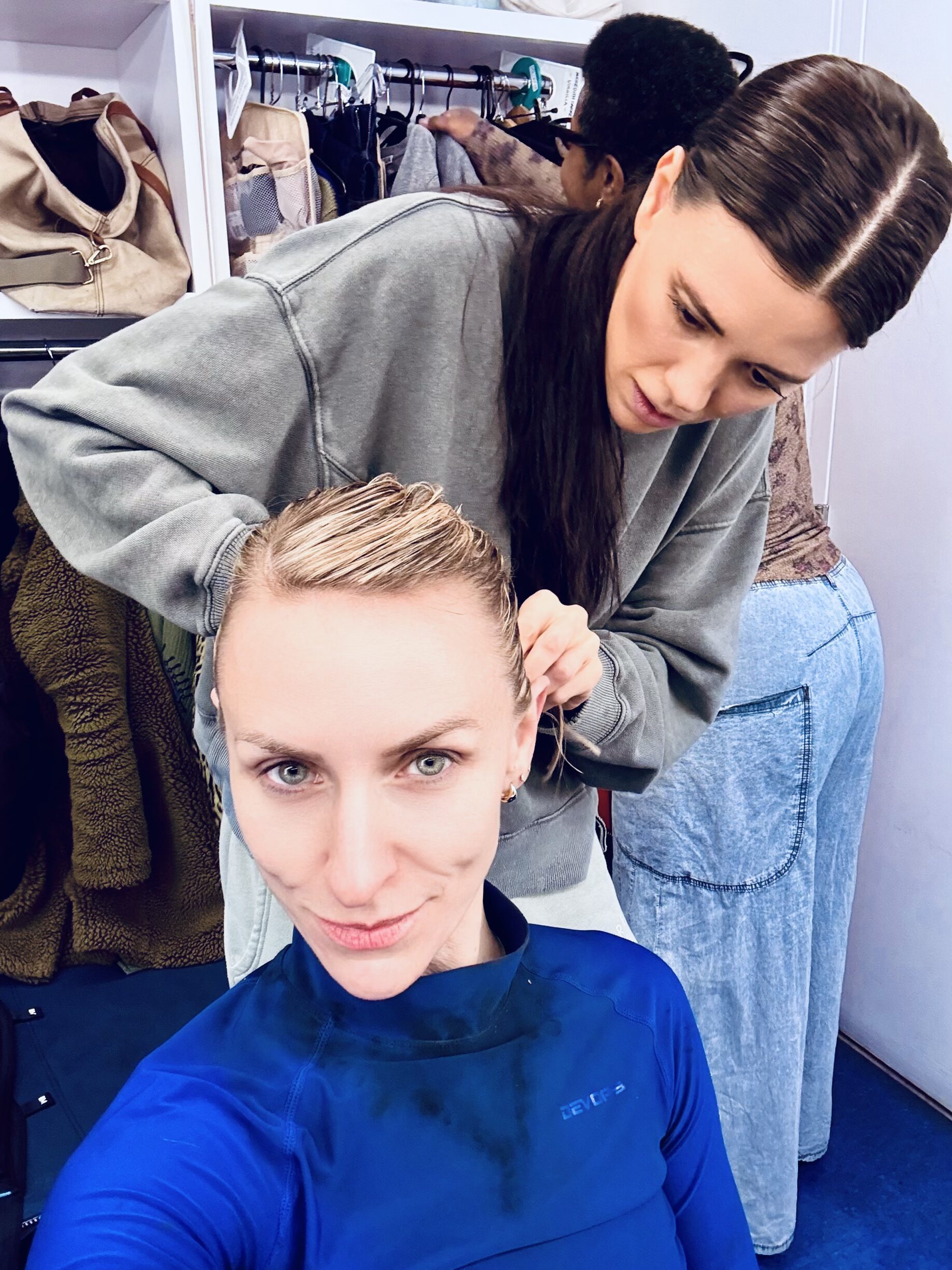 Meredeith Garretson helping Mickey Sumner with her hair