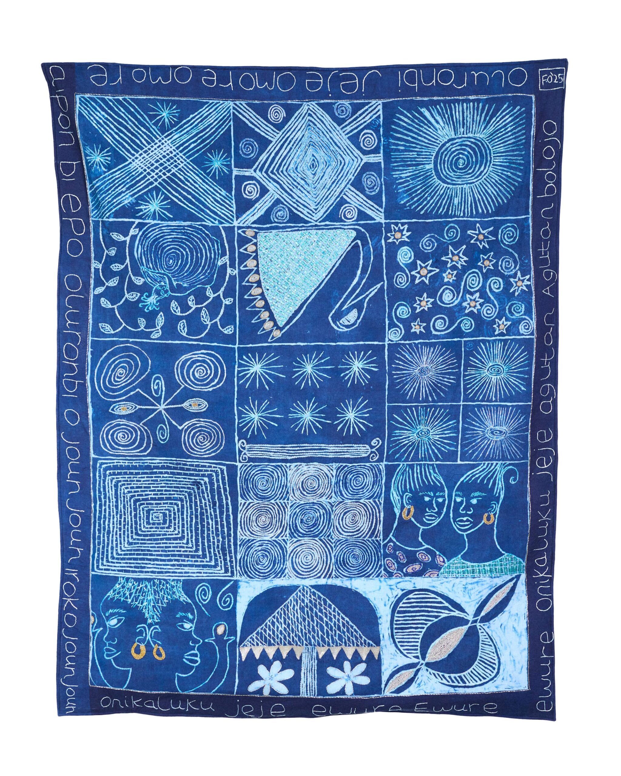 A woven tapestry by Nigerian artist Fadekemi Ogunsanya is draped, featuring blue panels with imagery of shapes, people, and stars