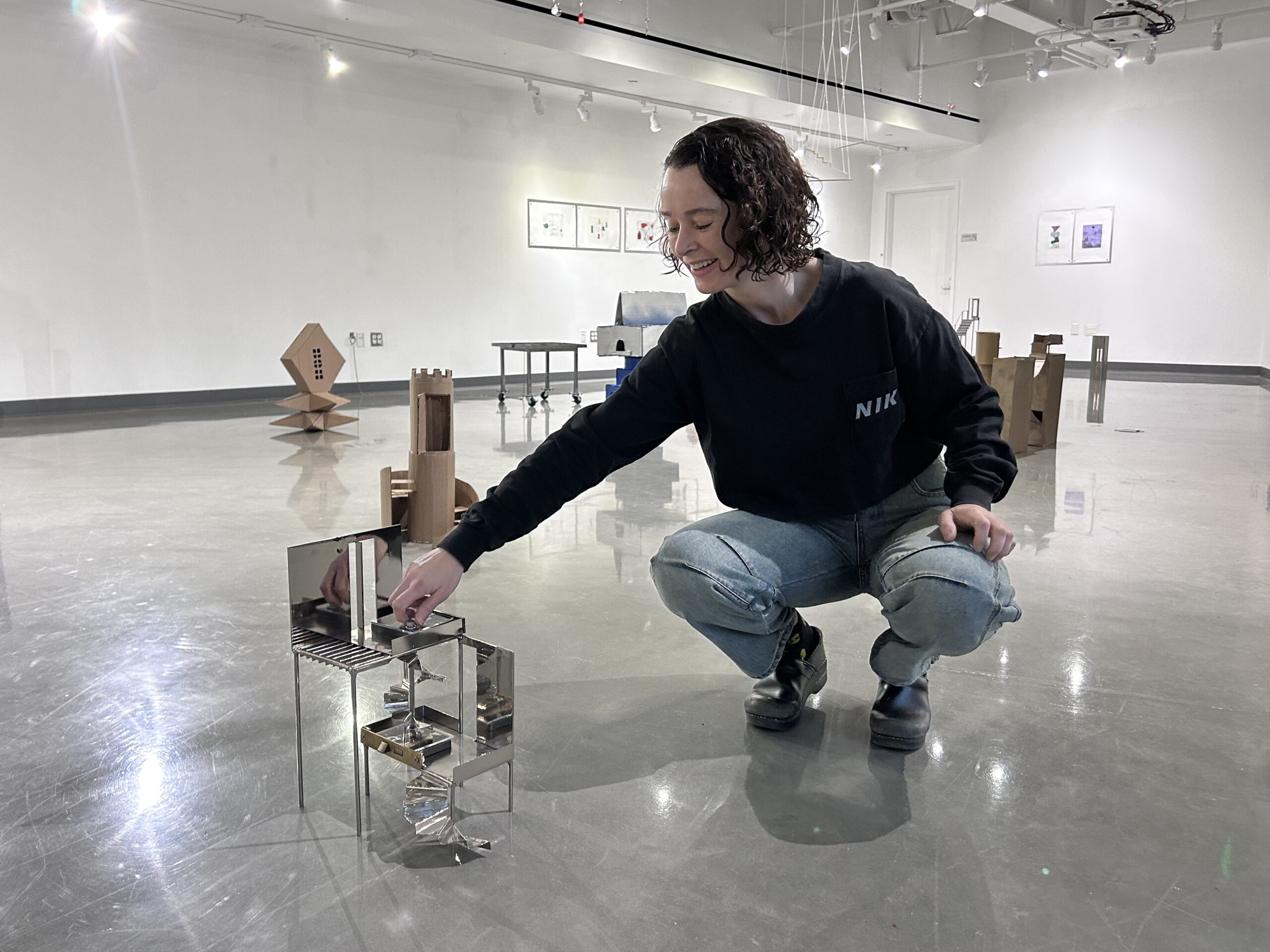 Tanya Brodsky demonstrates rotating the stairs on her sculpture Mortise, 2025.