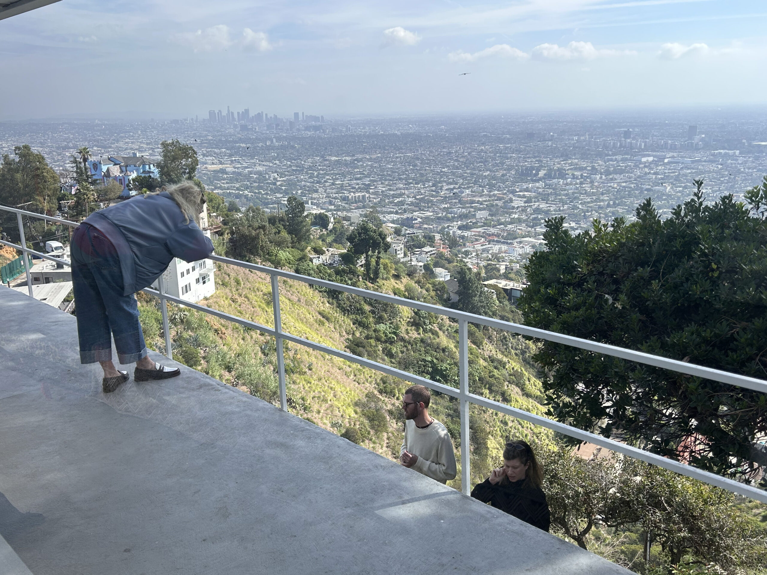 Rita McBride (left) chatting with Matt Moravec of Konrad Fischer and artist Alex Heilbron at Blue Heights Arts & Culture.