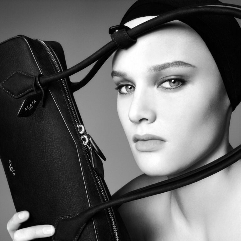A model poses with a bag in the final Alaïa campaign by designer Pieter Mulier