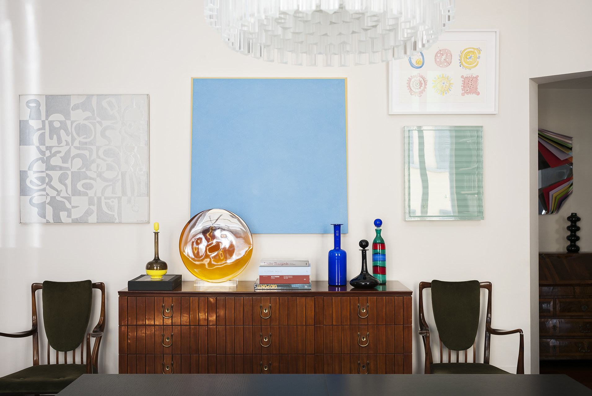 The collection of Nicole-Saikalis Bay is presented in her palazzo in Milan, including paintings, furniture, and tableside bottles