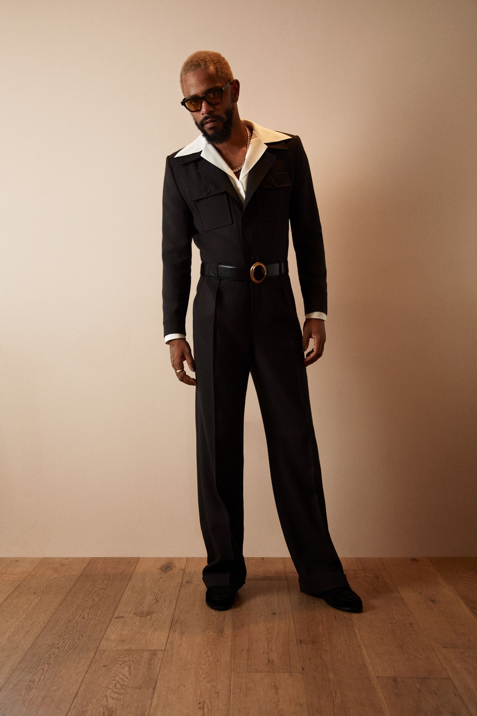 LaKeith Stanfield poses for a portrait in a tailored suit