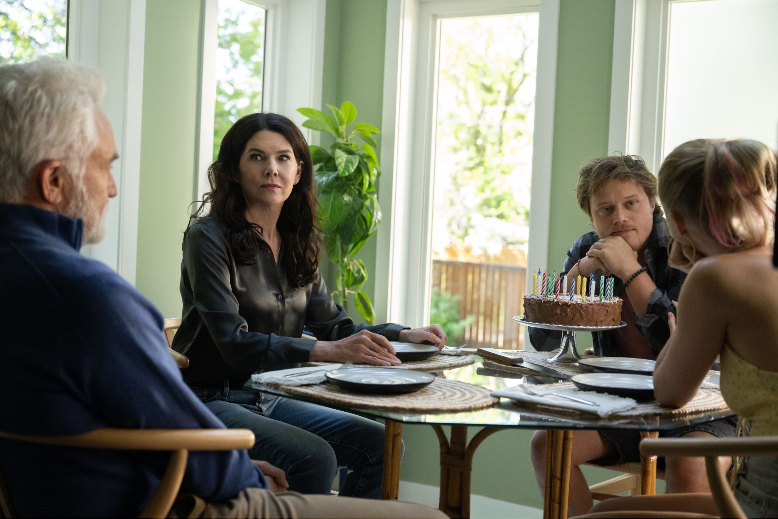 (from left) Patrick Landry (Bradley Whitford), Grace Landry (Lauren Graham), Scotty Landry (Rudy Pankow) and Kenna Rowan (Maika Monroe) in REMINDERS OF HIM, directed by Vanessa Caswill.