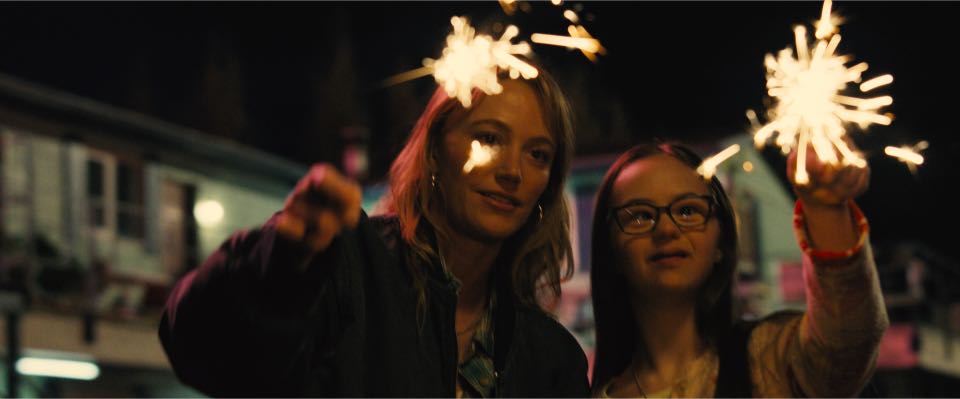 (from left) Kenna Rowan (Maika Monroe) and Lady Diana (Monika Myers) in REMINDERS OF HIM, directed by Vanessa Caswill.