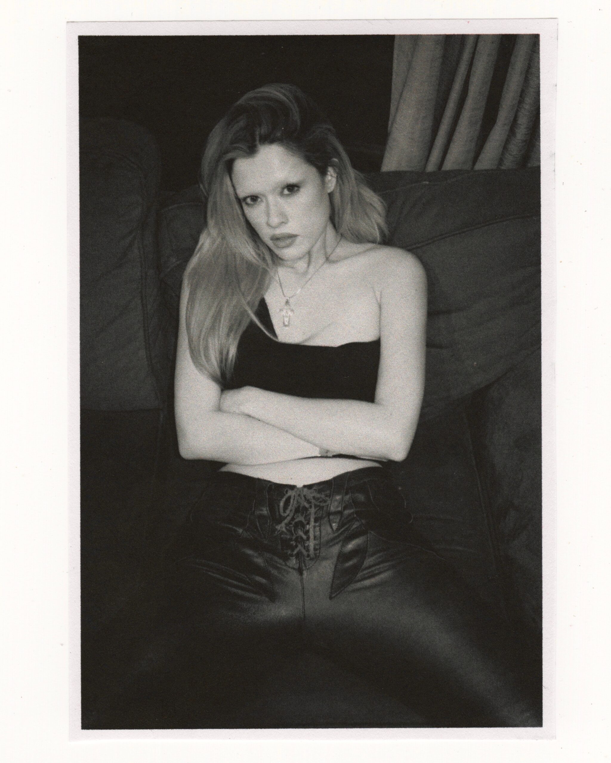 Avalon Lurks poses for a portrait in a vintage look