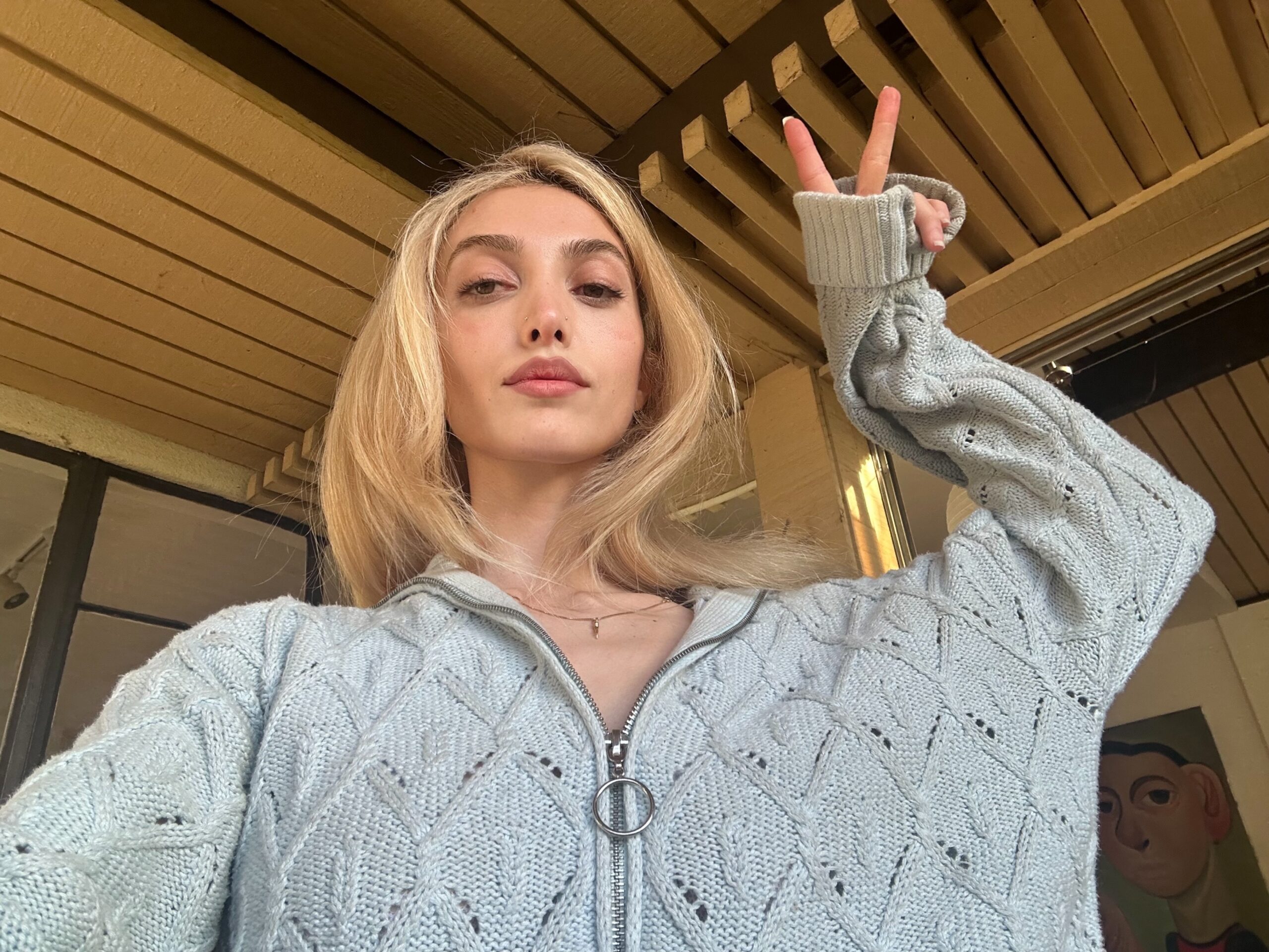 Jess Valice poses for a portrait in a vintage Gucci sweater