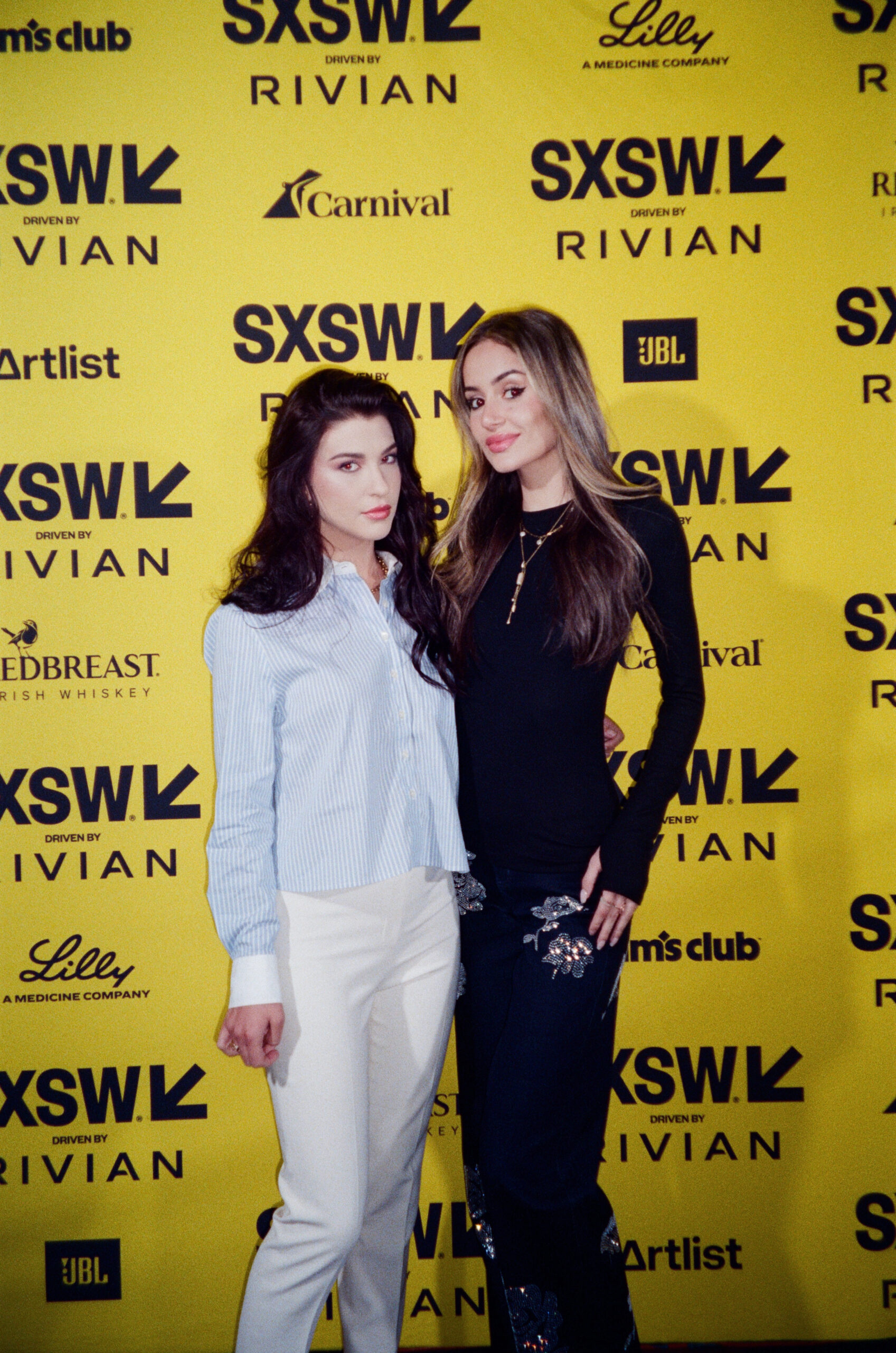 Phoebe Gates and Sophia Kianni pose for a portrait