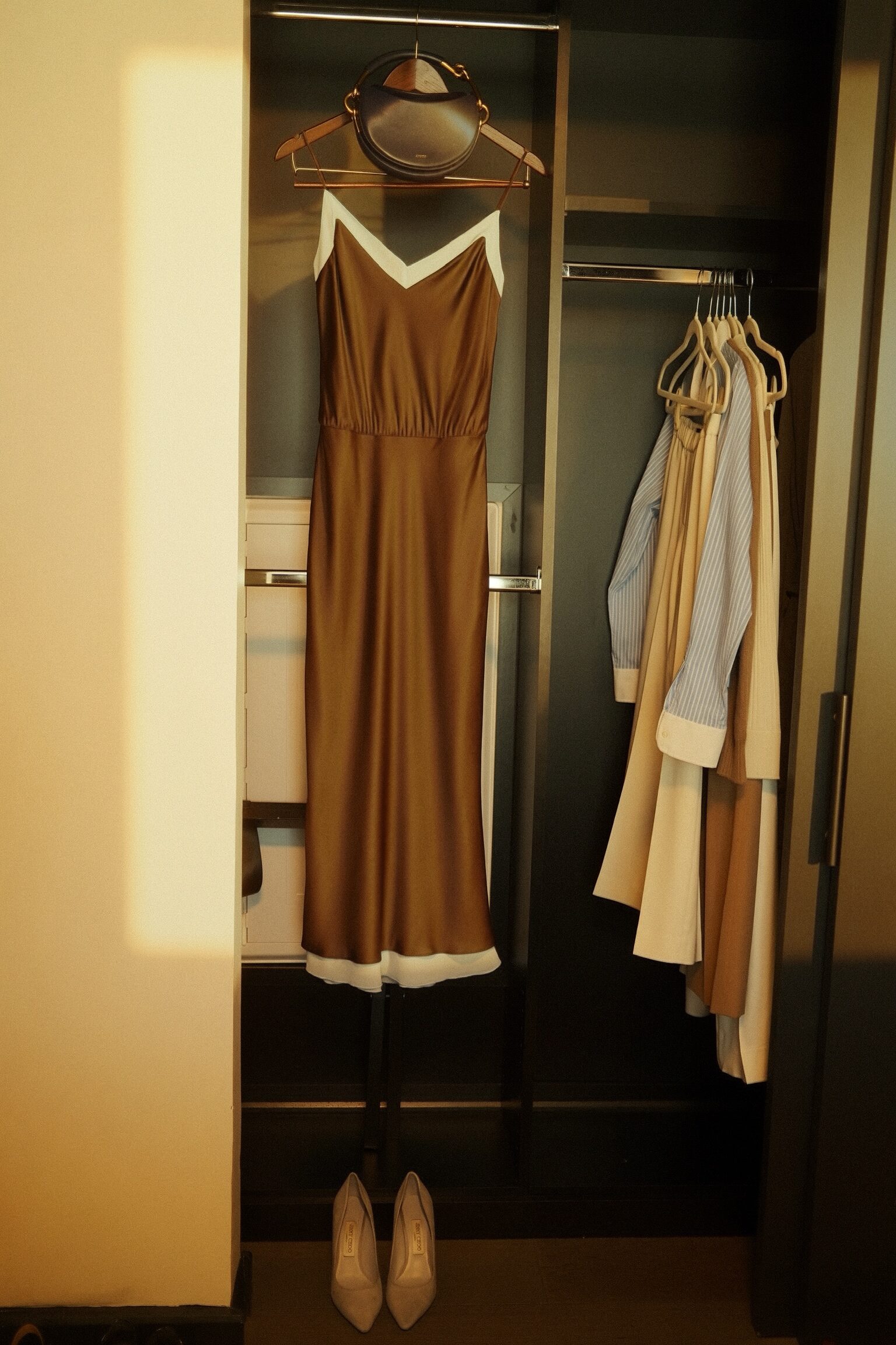 A closet snapshot featuring a Reformation look and slip dress