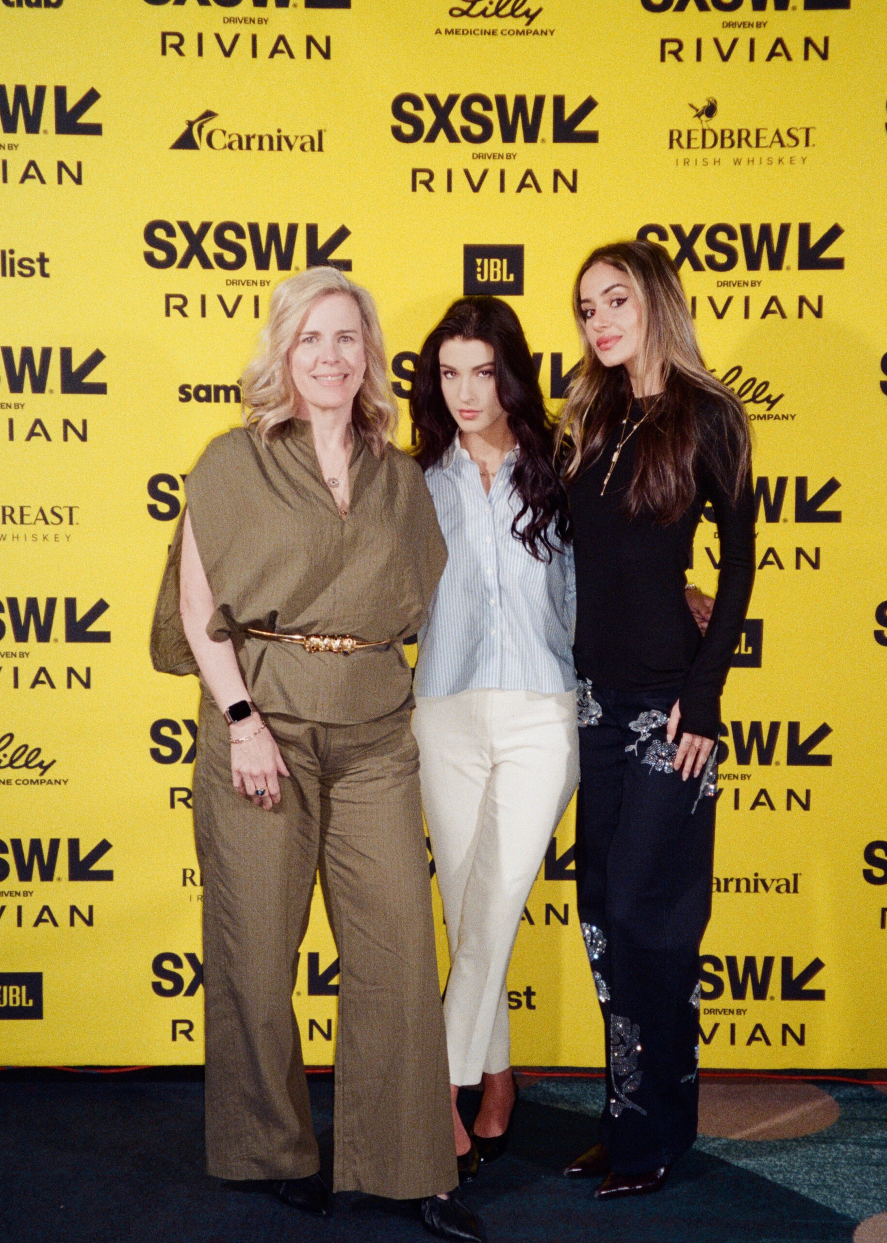 Joanne Bradford, Phoebe Gates, and Sophia Kianni pose for a portrait