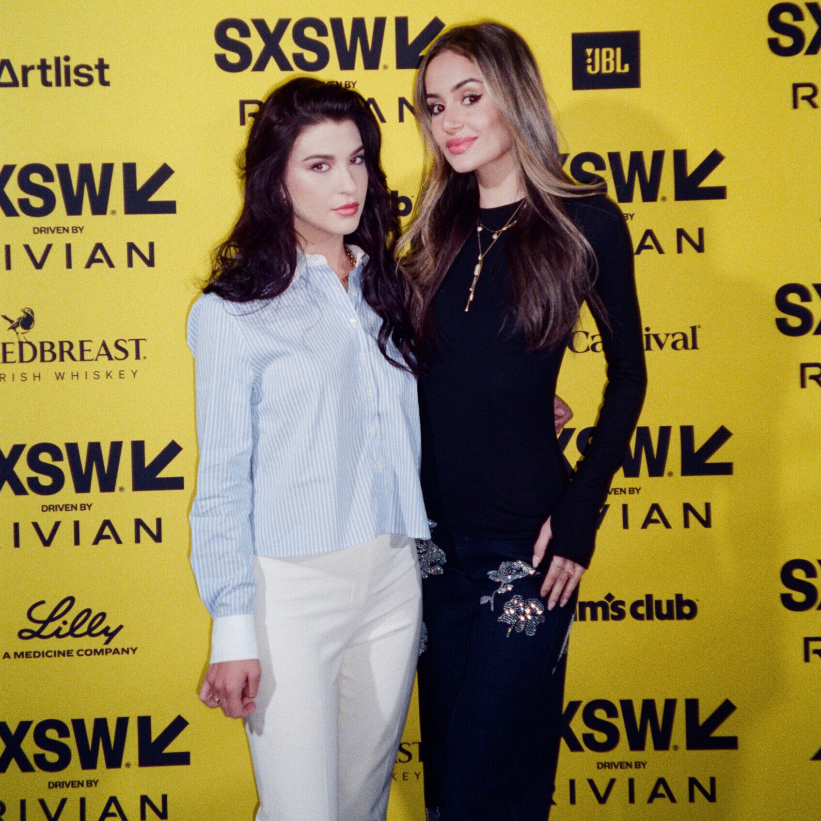 Phoebe Gates and Sophia Kianni pose for a portrait