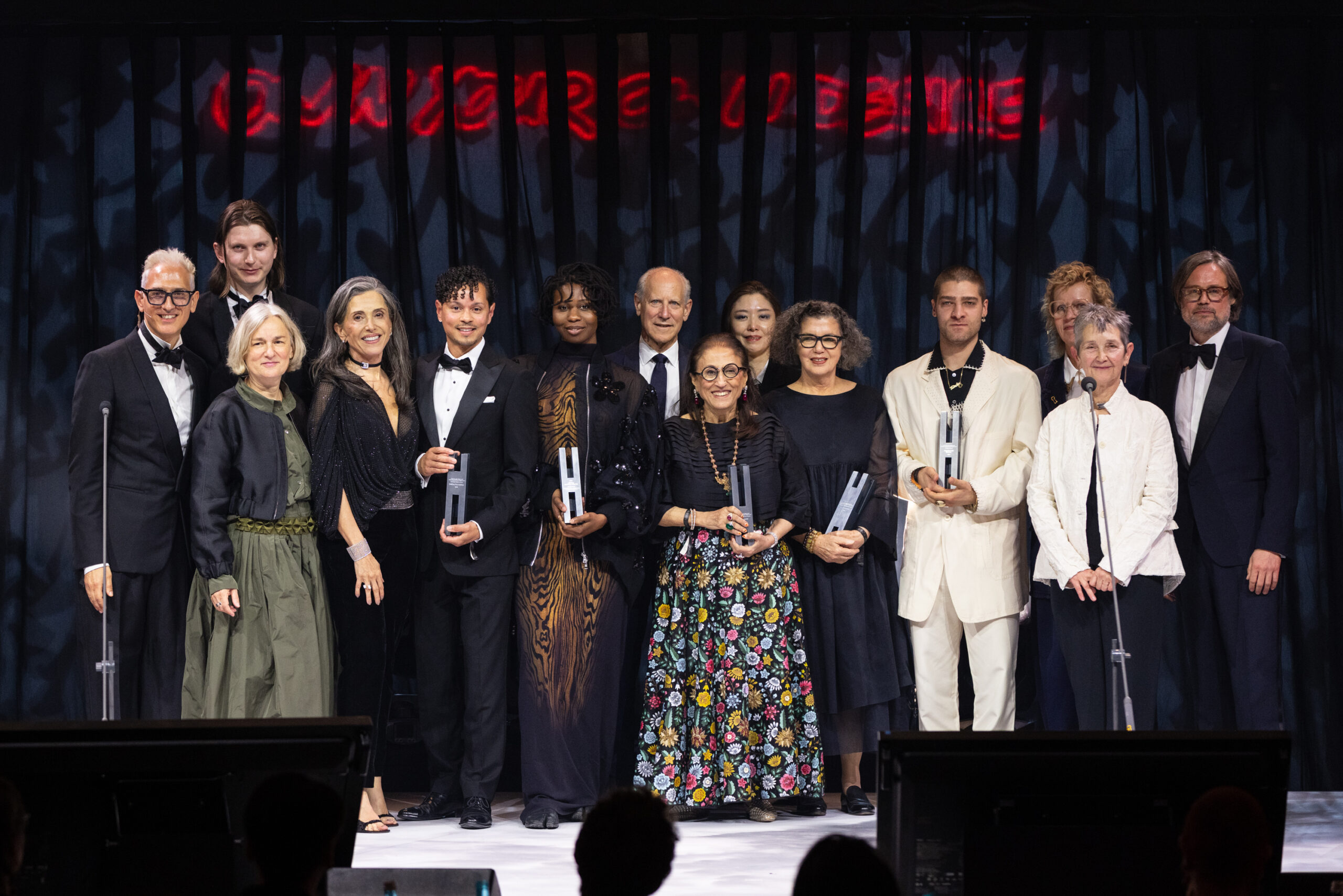 Jonas Roßmeißl, Gabriele Knapstein, Füsun Eczacıbası, Aaron Cezar, Monilola Olayemi Ilupeju, Glenn Lowry, Kiran Nadar, Ayoung Kim, Mona Hatoum, and Abdulhamid Kircher pose for a portrait at the Hamburger Banhof gala