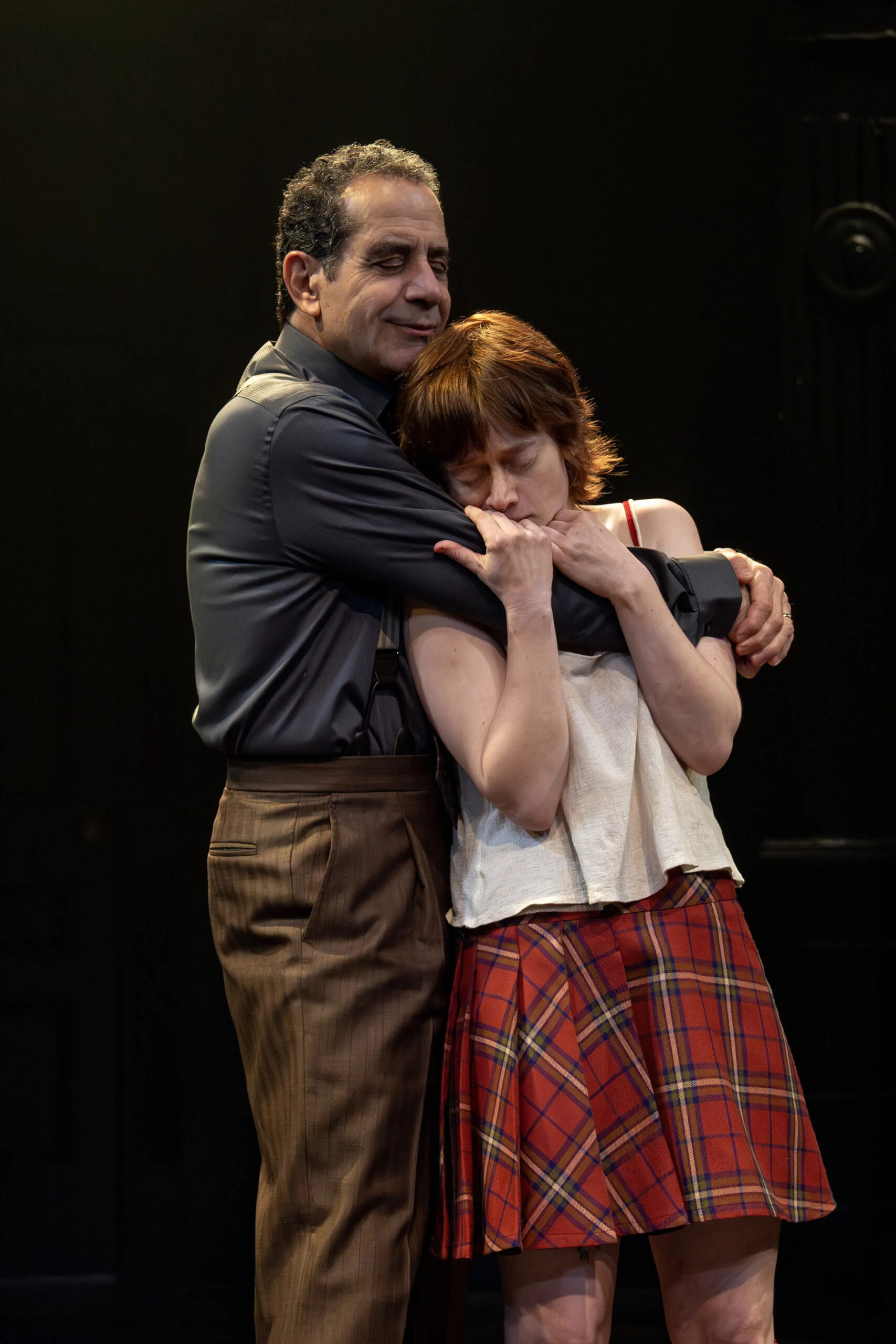 Tony Shalhoub and Susanna Perkins embrace on-stage