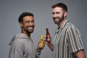 Anthony Norman and Ronald Gladden with Rockin' Grandma's hot sauce