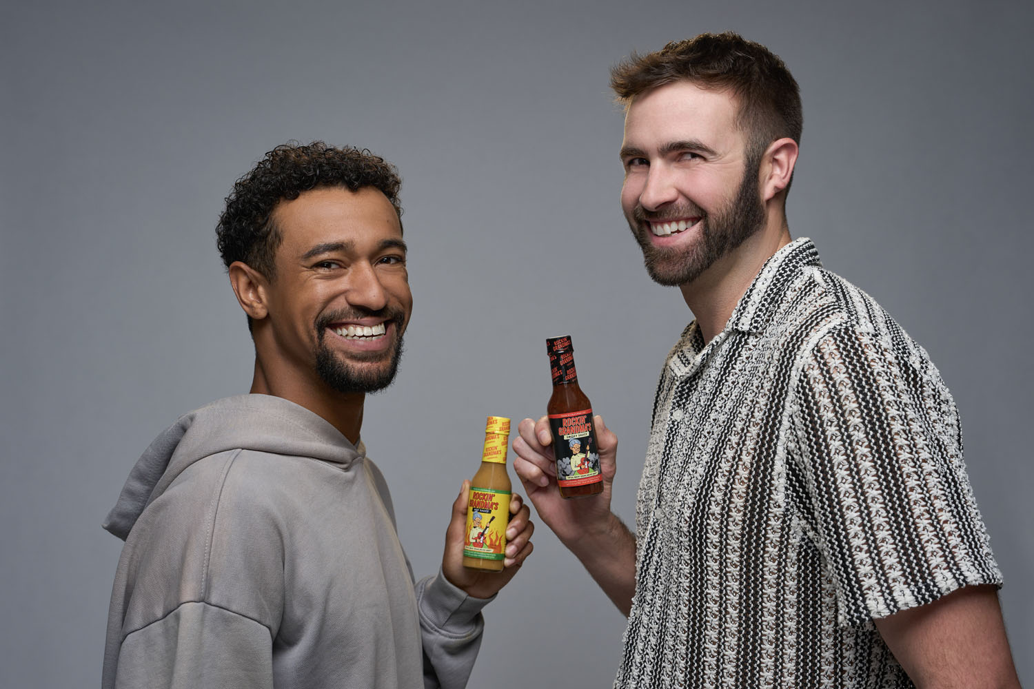 Anthony Norman and Ronald Gladden with Rockin' Grandma's hot sauce