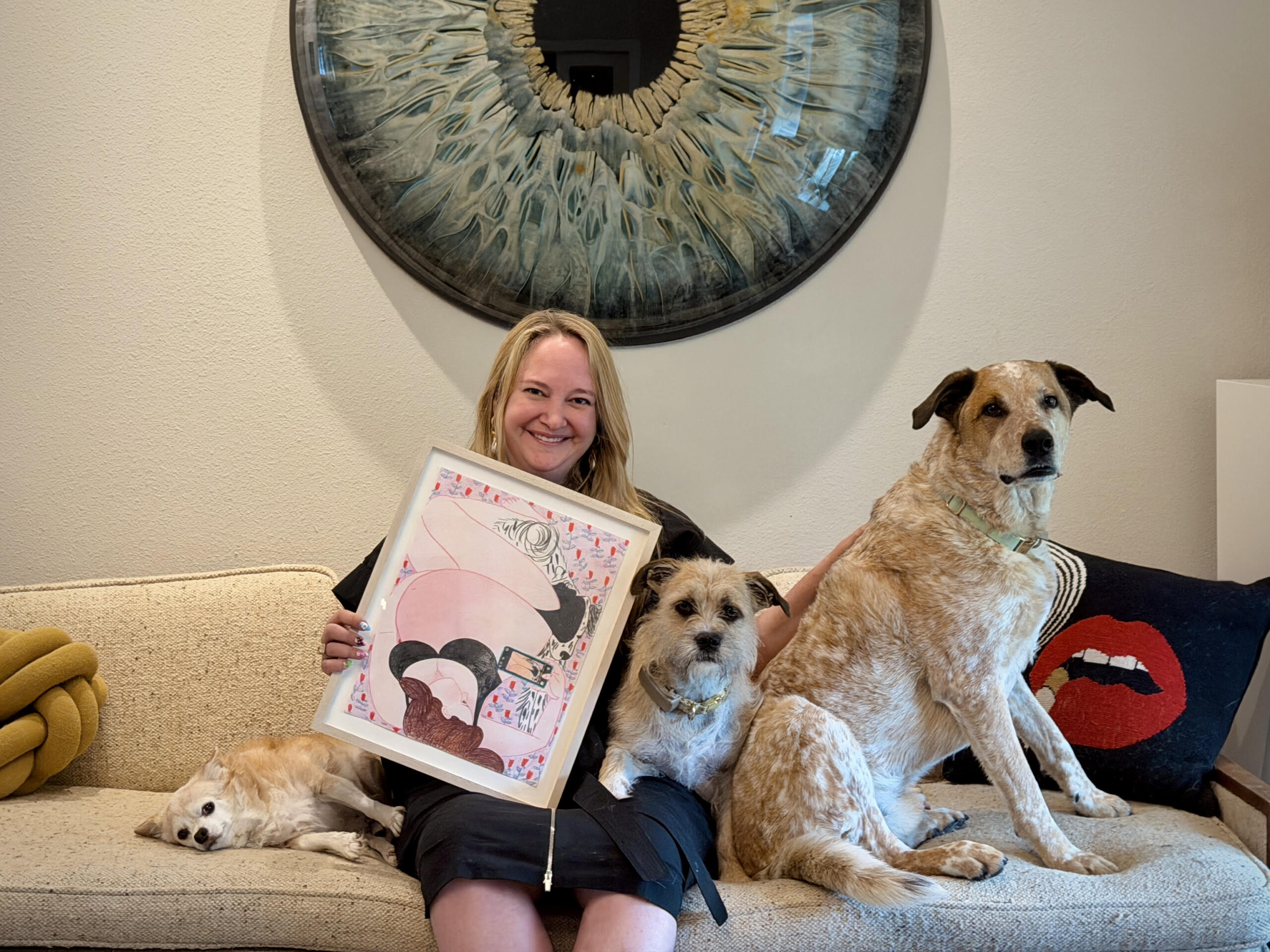 Grace Cook poses for a portrait at home in Dallas with her dogs