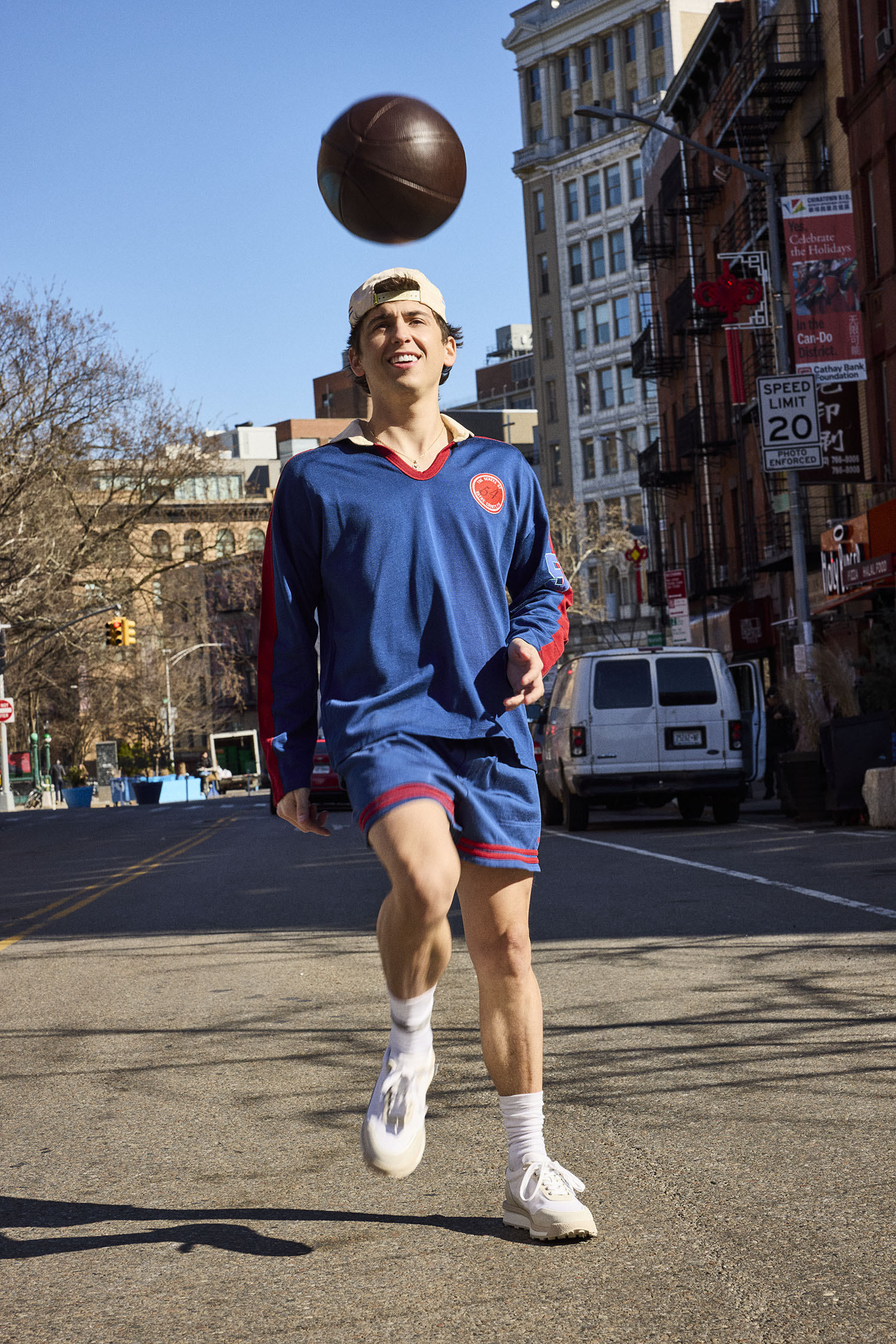 Marcello Hernandez wears a shirt and shorts by Bode with shoes and socks by Thom Browne.