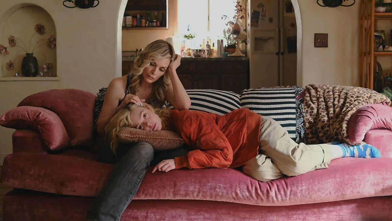 elle-fanning-michelle-pfeiffer-margos-got-money-trouble Michelle Pfeiffer strokes Elle Fanning's hair on a pink couch in Margo's Got Money Troubles