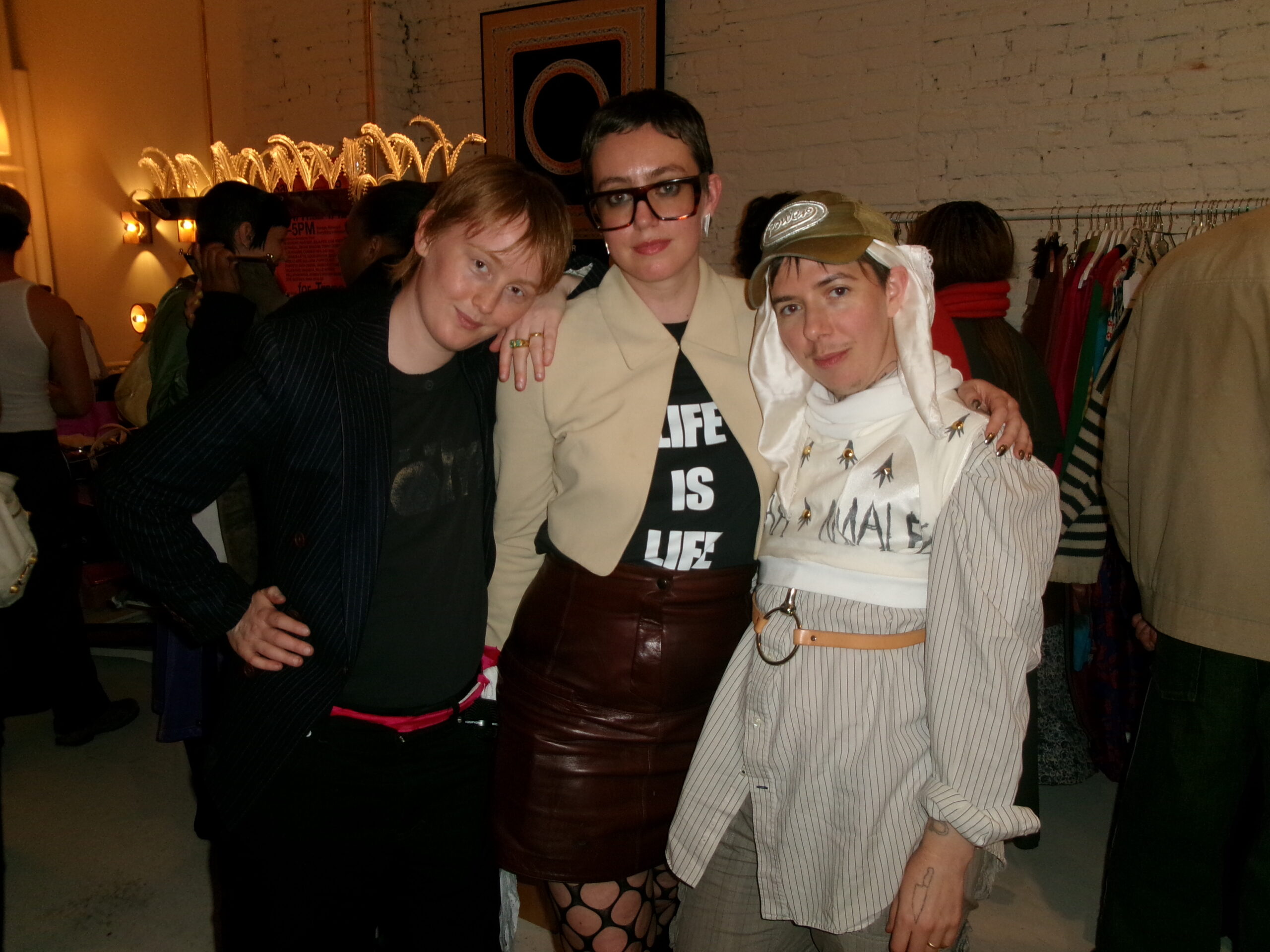 Bobbi Salvör Menuez, Whitney Mallett, and Quori Theodor pose for a photo