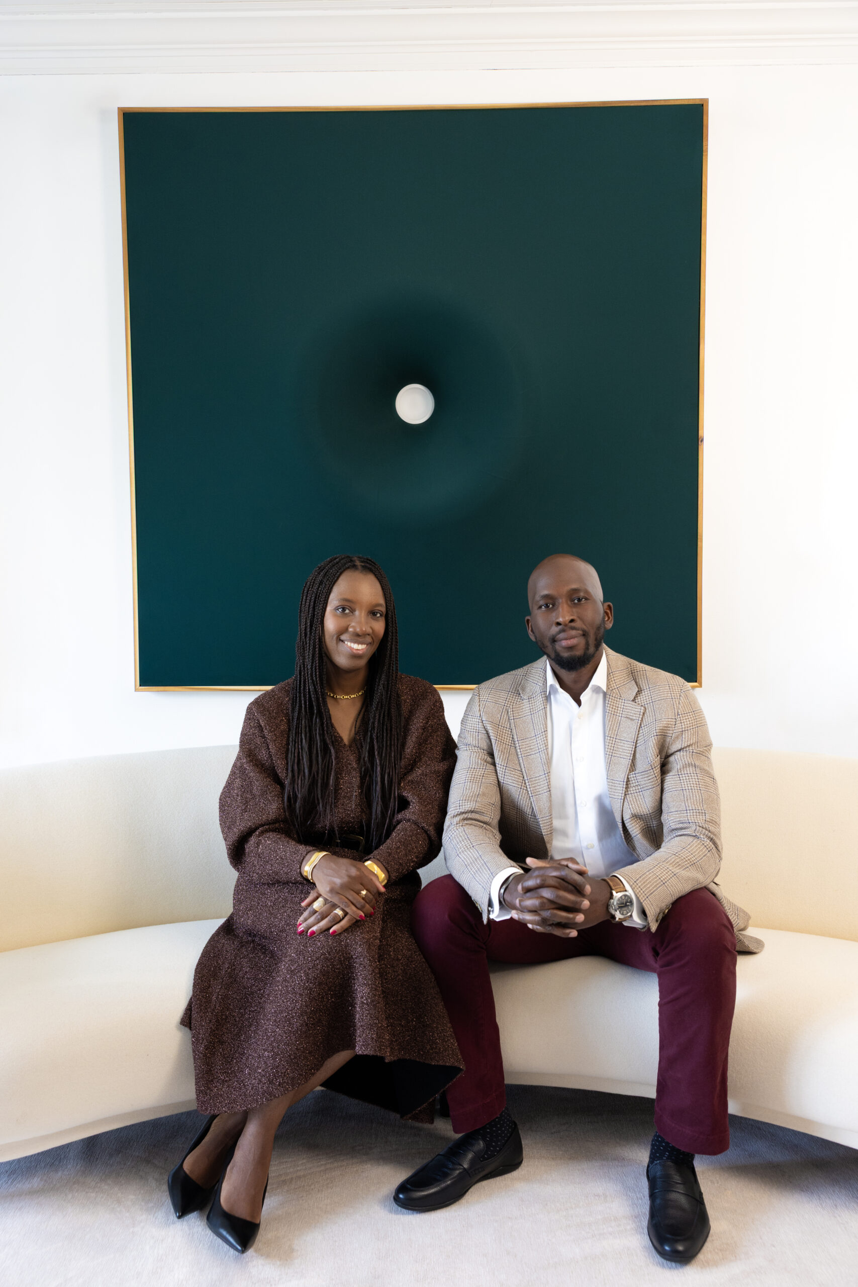 Mamadou-Abou Sarr and Catherine Sarr pose for a portrait in their Chicago home