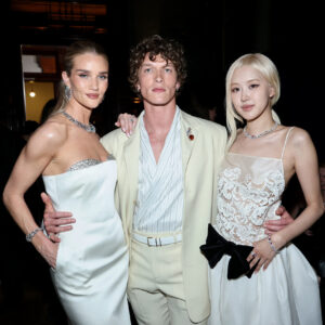 Rosie Huntington-Whiteley, Connor Storrie, and Rosé pose for a portrait
