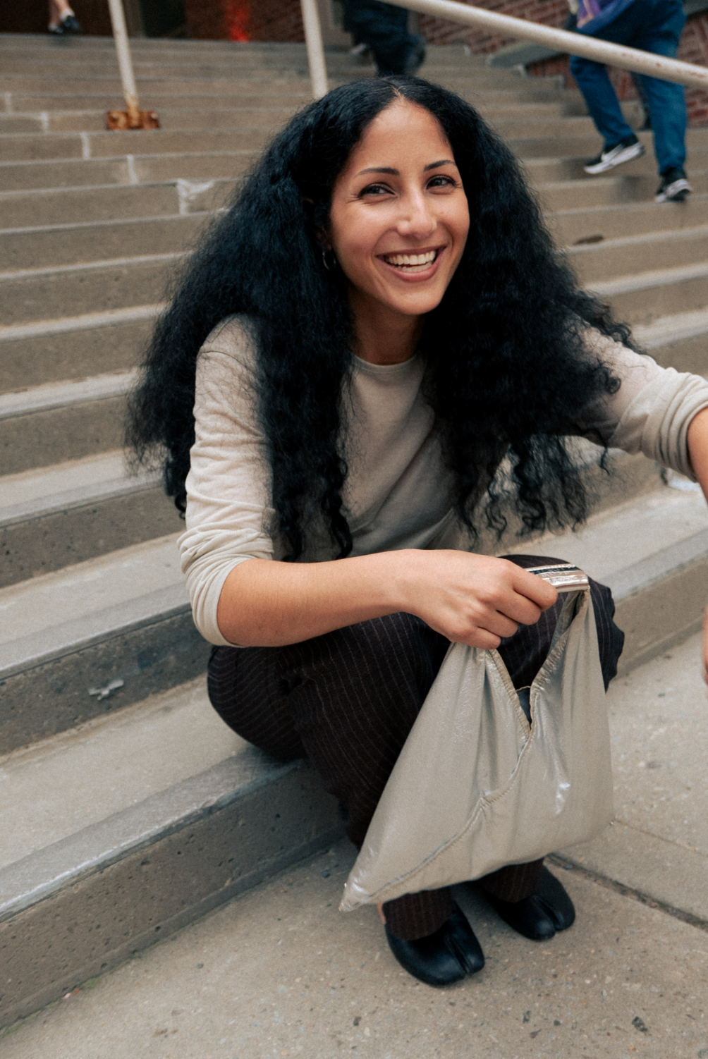 Farah Al Qasimi on steps at MoMA PS1