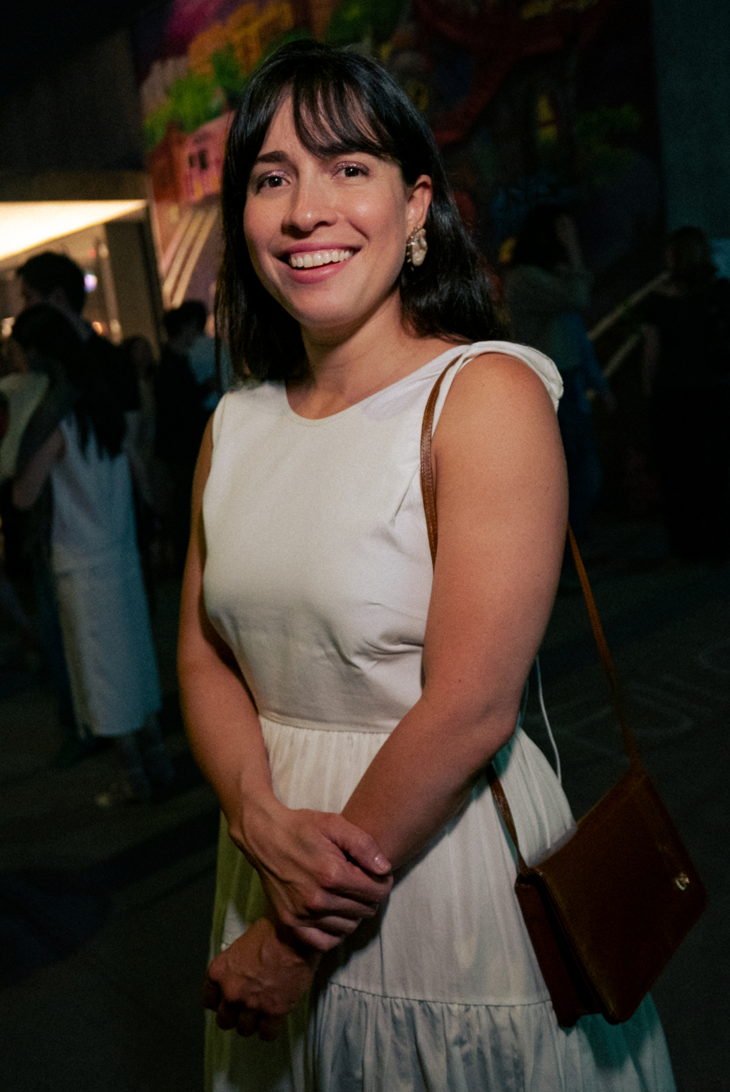 Maria Elena Pombo in white dress at MoMA PS1 exhibition