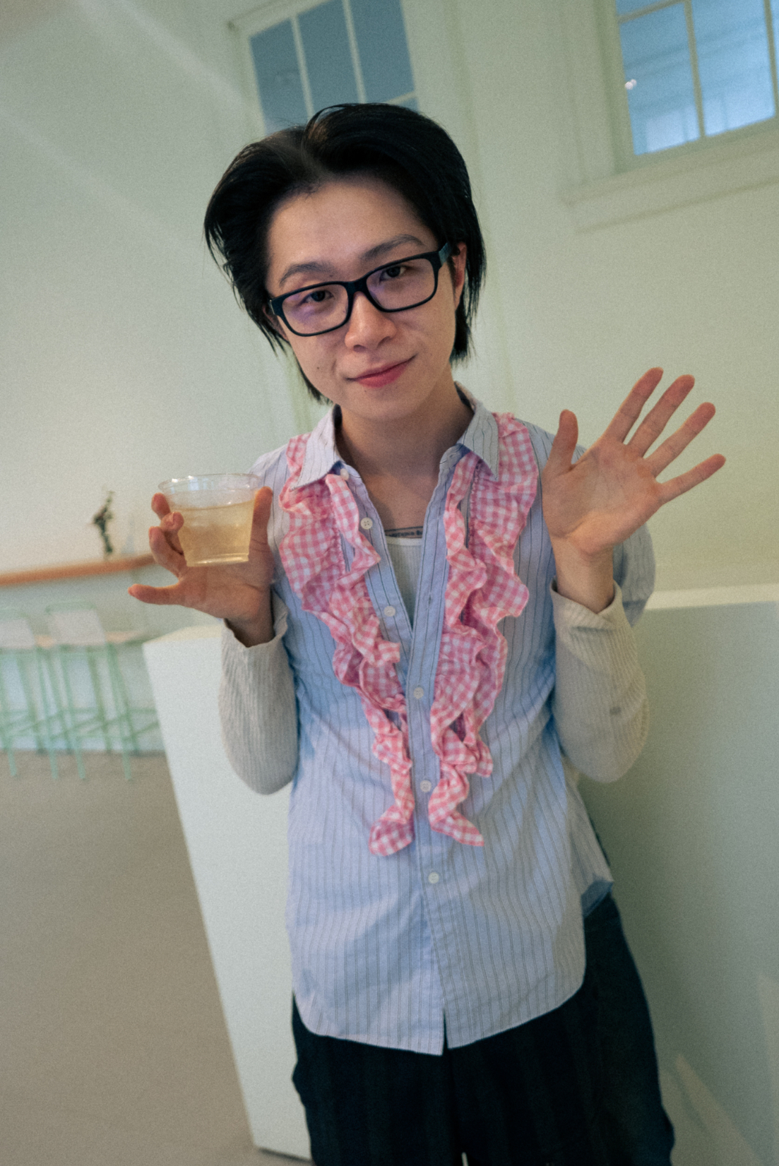 Louis Osmosis in a blue button up at MoMA PS1