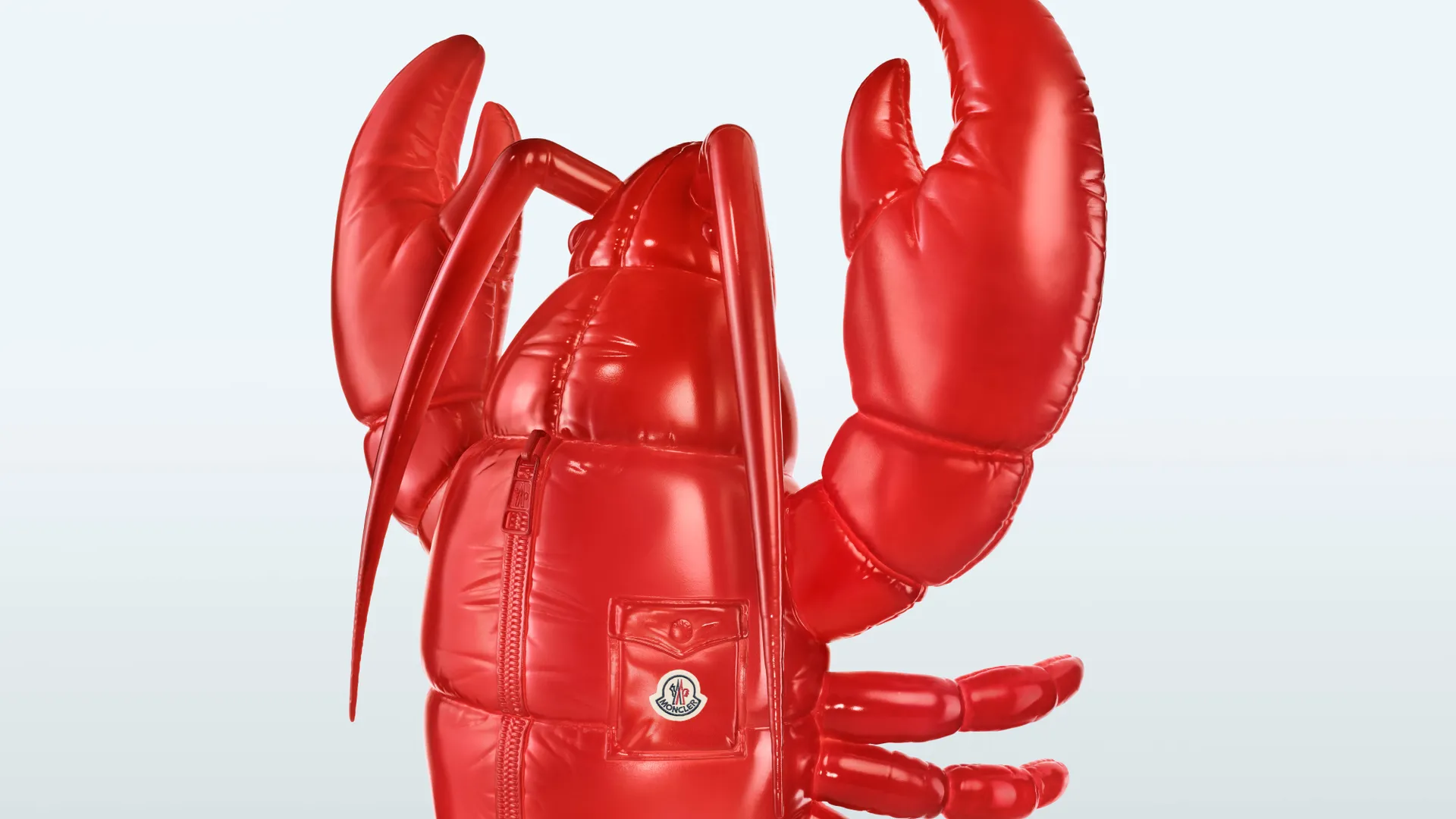 An inflatable lobster stars in Moncler's Have a Puffy Summer campaign against a white background