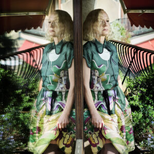 Prada collector Nicoletta Santoro poses for a portrait full Prada in her Milan home