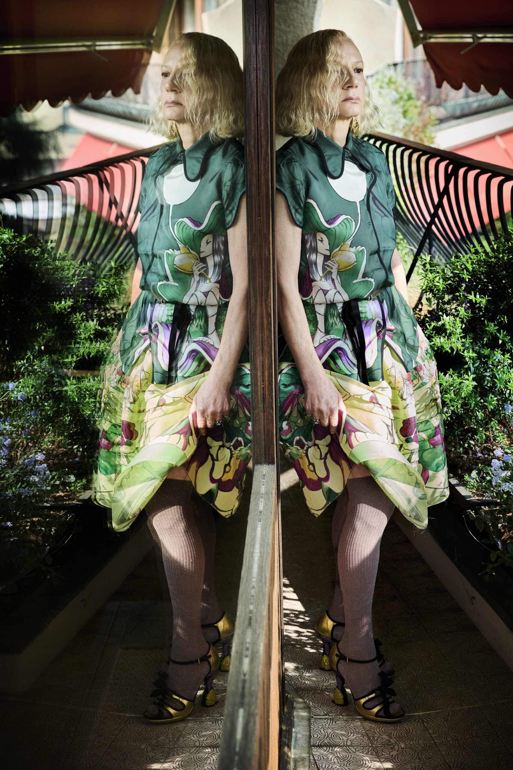 Prada collector Nicoletta Santoro poses for a portrait full Prada in her Milan home