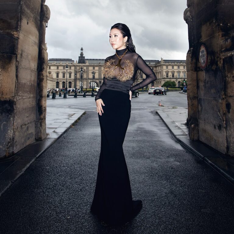 Kuo poses for a portrait in Schiaparelli haute couture by Daniel Roseberry at Le Musée des Arts Décoratifs’ inaugural grand Bal d’été