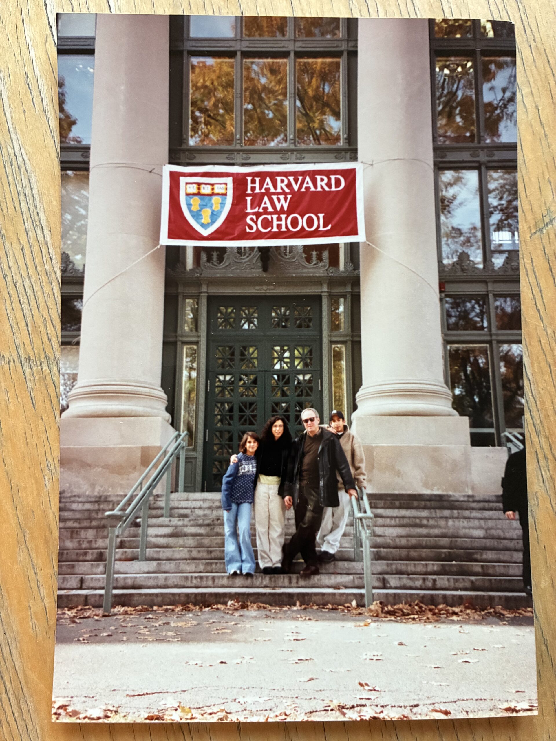 literature-jodi-kantor-how-to-start-book-sarah-harrelson Jodi Kantor and her family pose on the steps of a Harvard Law School building amidst fall leaves and against two columns