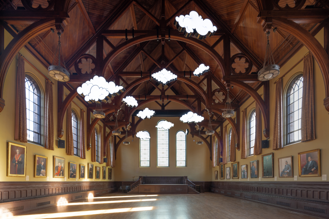 clouds hanging from ceiling in a large open museum space