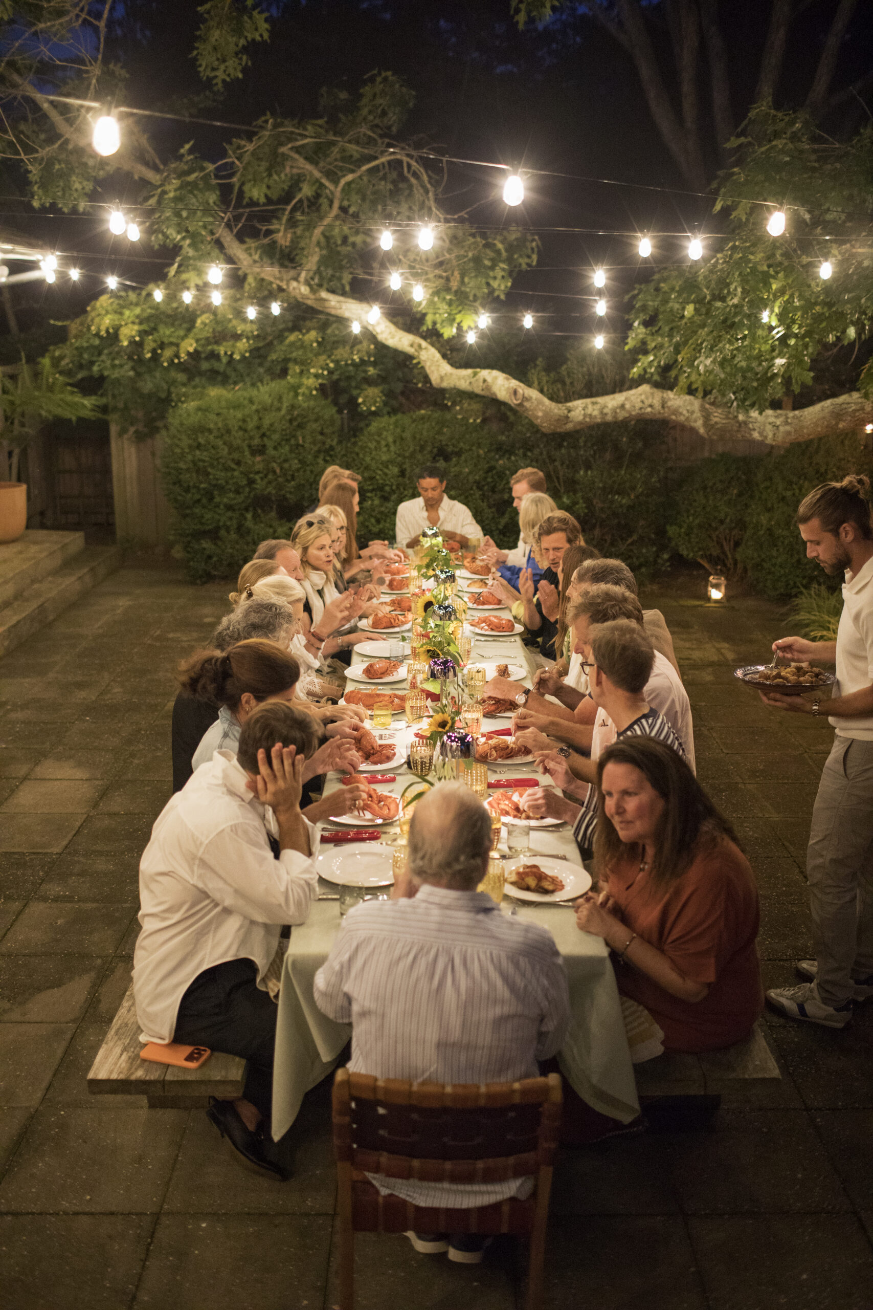 In East Hampton, an Art Whisperer Welcomed Guests for an Evening of Lobster and Summer Mischief