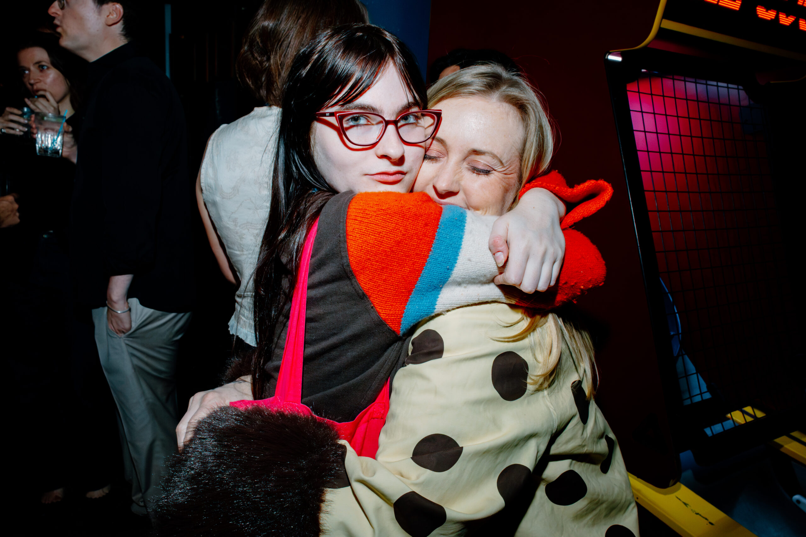 Ivy Wolk and Courtney O’Donnell embrace at The Holes event.