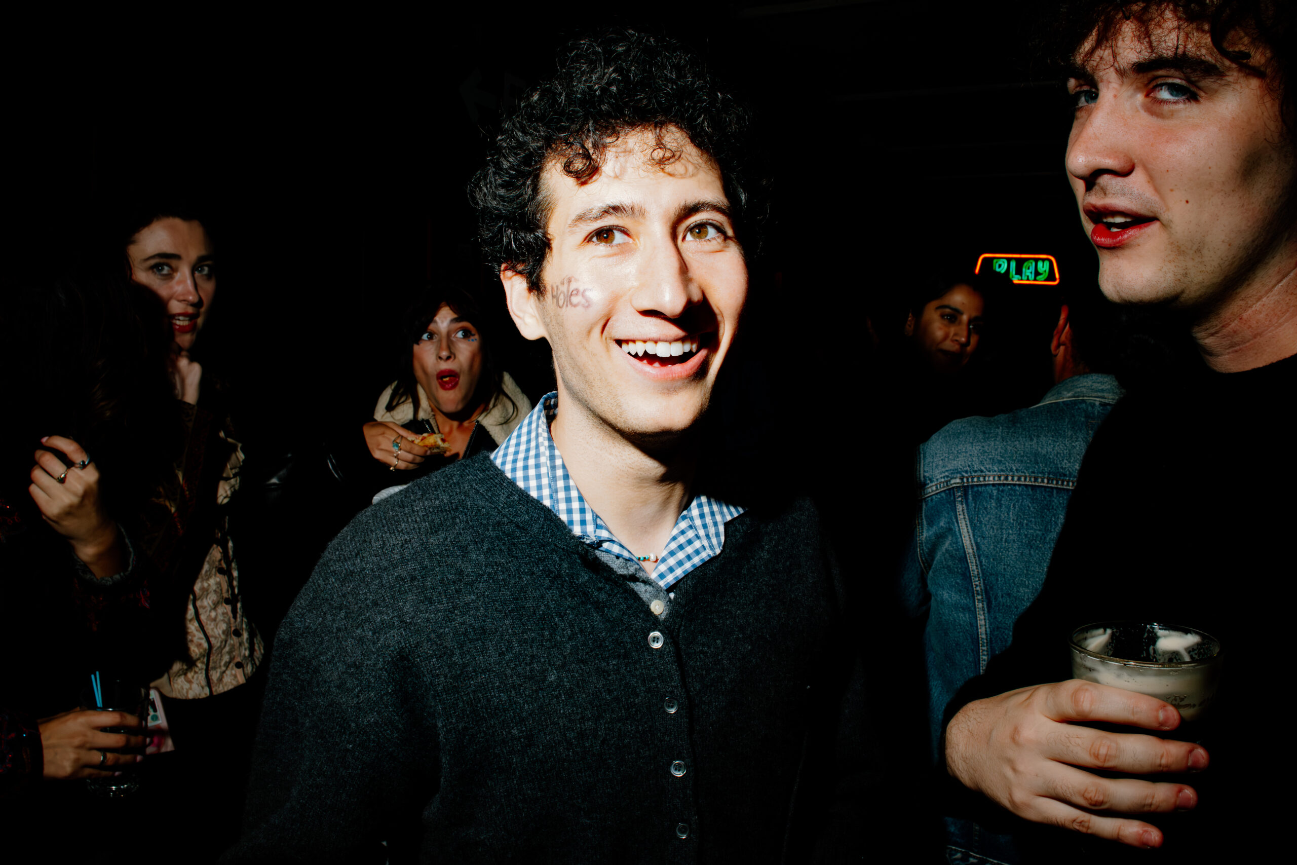 Evan Lazarus and Charlie Rhinehart-Jones stand together at The Holes event.